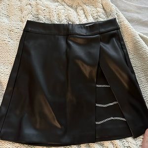 Faux leather mini skirt with silver chains on a side in size XS/0